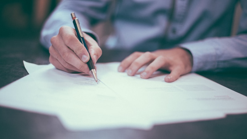 Legal documents and pen on a desk